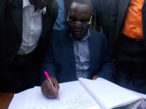 Nyatike MP Edick Anyanga signs Okoa Kenya signature book at Wath Onger center