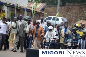 Awendo MP Jared Kopiyo (wearing a brown jacket) leads sugarcanes on demonstrations against cheap sugar imports which cripples the sector in Awendo Town on June 28.