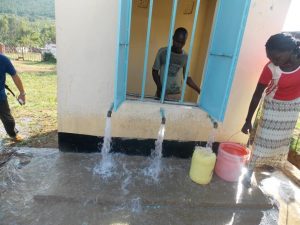 A woman draws water from a similar Sh986million water and sanitation project launched in Migori town on July 3, 2014. What happened to the project?