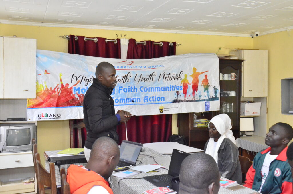 Austin Okello, chair of the Migori interfaith youth network while talking to fellow youth and sharing his experience after expose by the IRCK, where he changed his perception of the roles of the youth in society. Photo by Polycarp Ochieng.